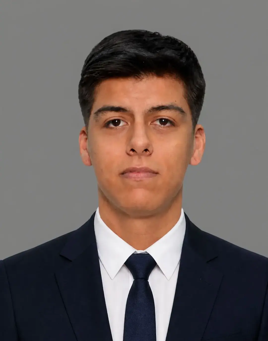 A professional portrait of Julio, a co-founder of Ares Moving, presented with a modern corporate aesthetic. He exudes reliability and precision, dressed in high-quality professional attire. The image is bright and clean, emphasizing trust and logistical expertise through high-key lighting and a sophisticated composition.